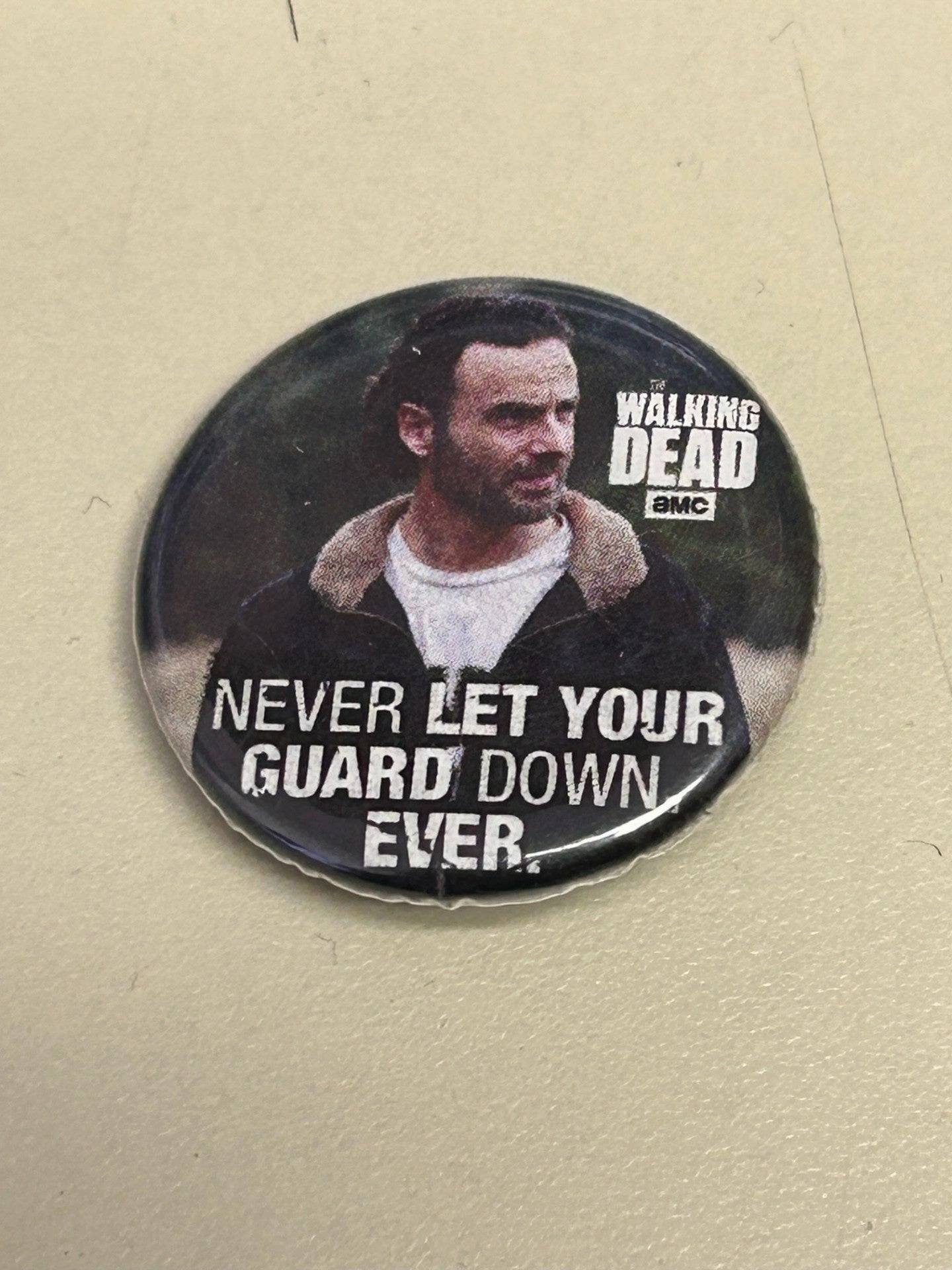 The Walking Dead - Never Let Your Guard Down Ever 1.25" Button Enchanting Accessories